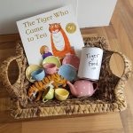 The Tiger Who Came to Tea and other items on a wicker tray